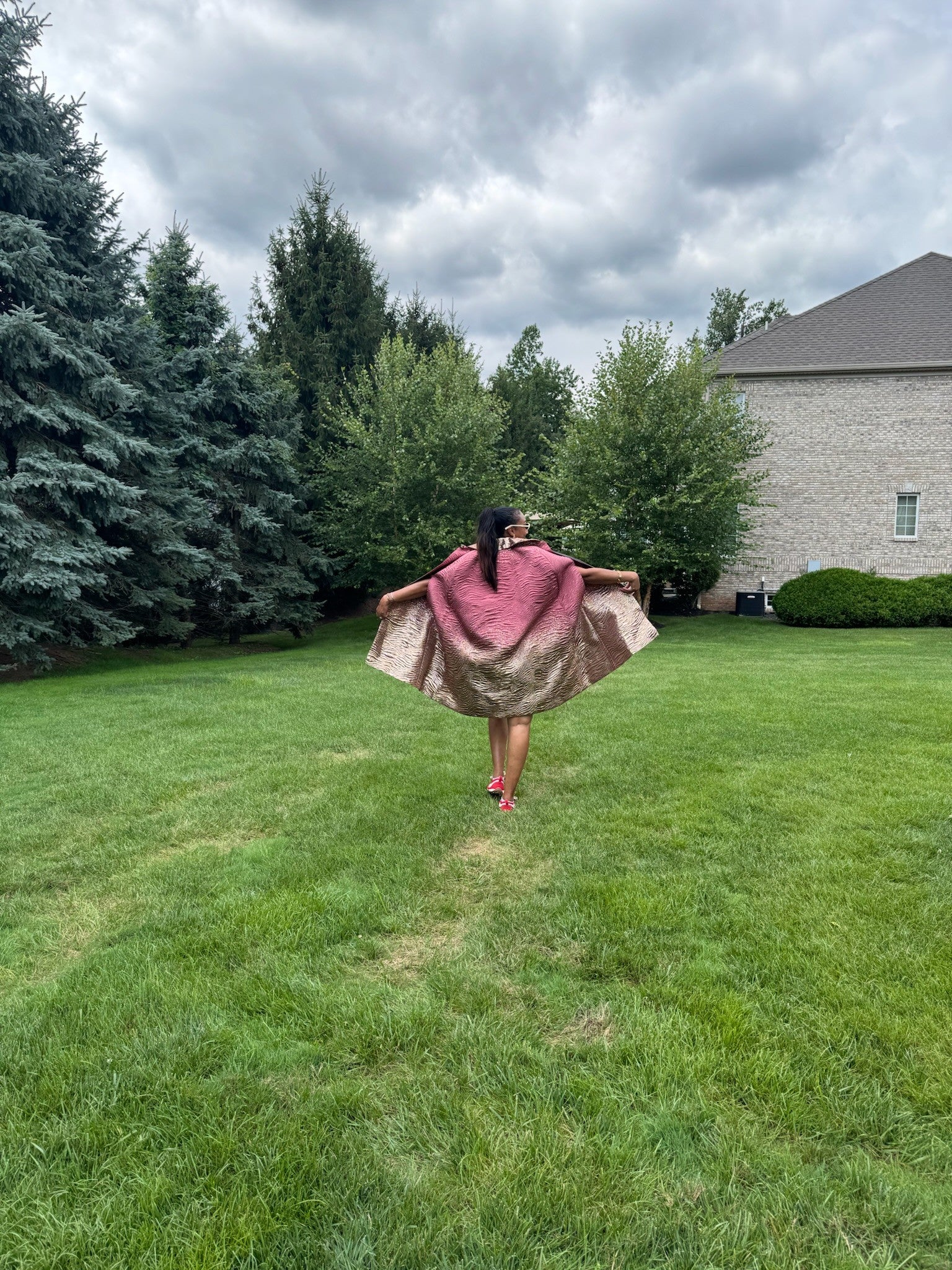 The Rose Gold Cape, full swing in motion