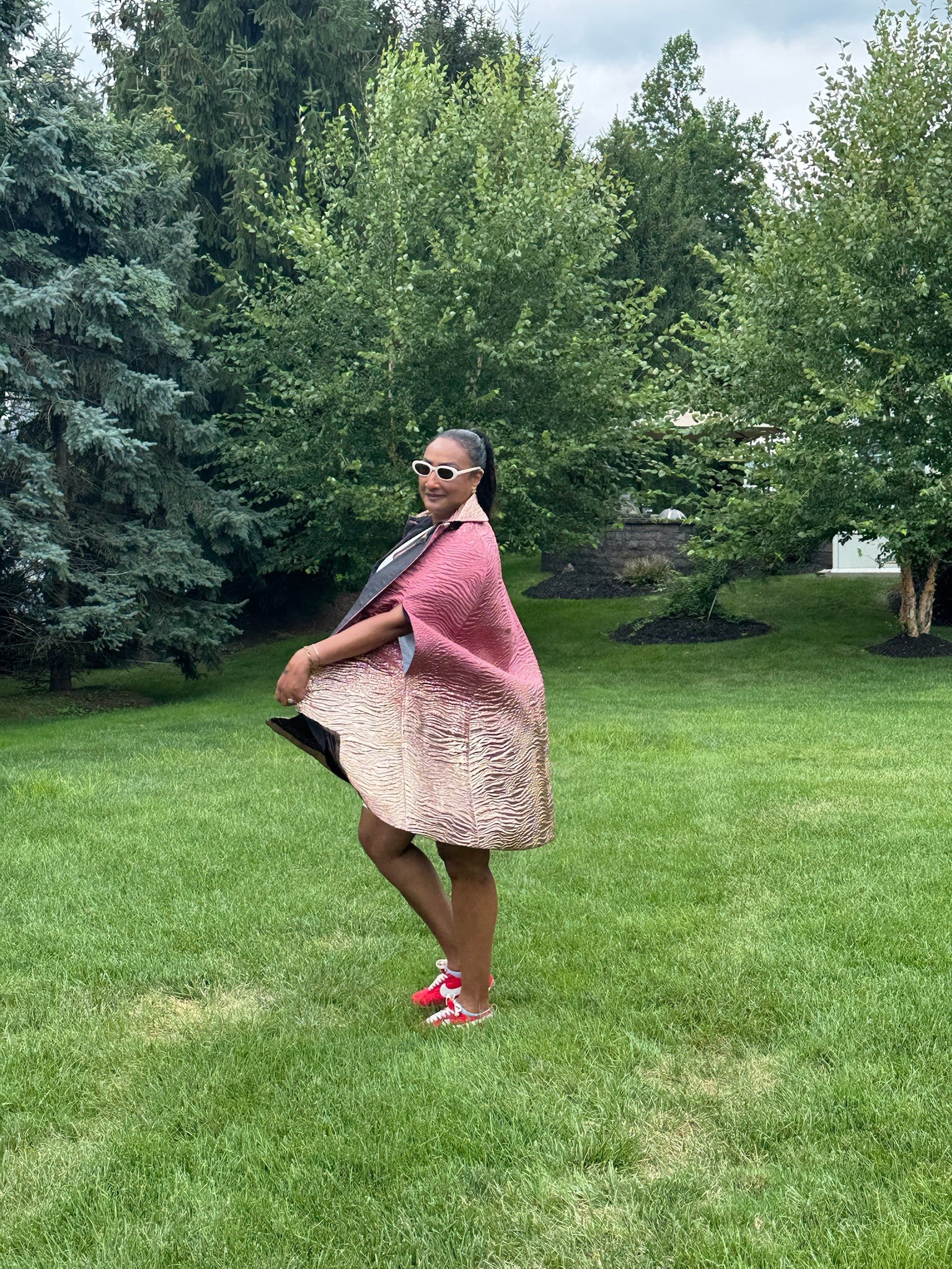 The Rose Gold Cape, side silhouette view