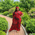 Front view of The Crimson Caftan in red with dark botanical motifs