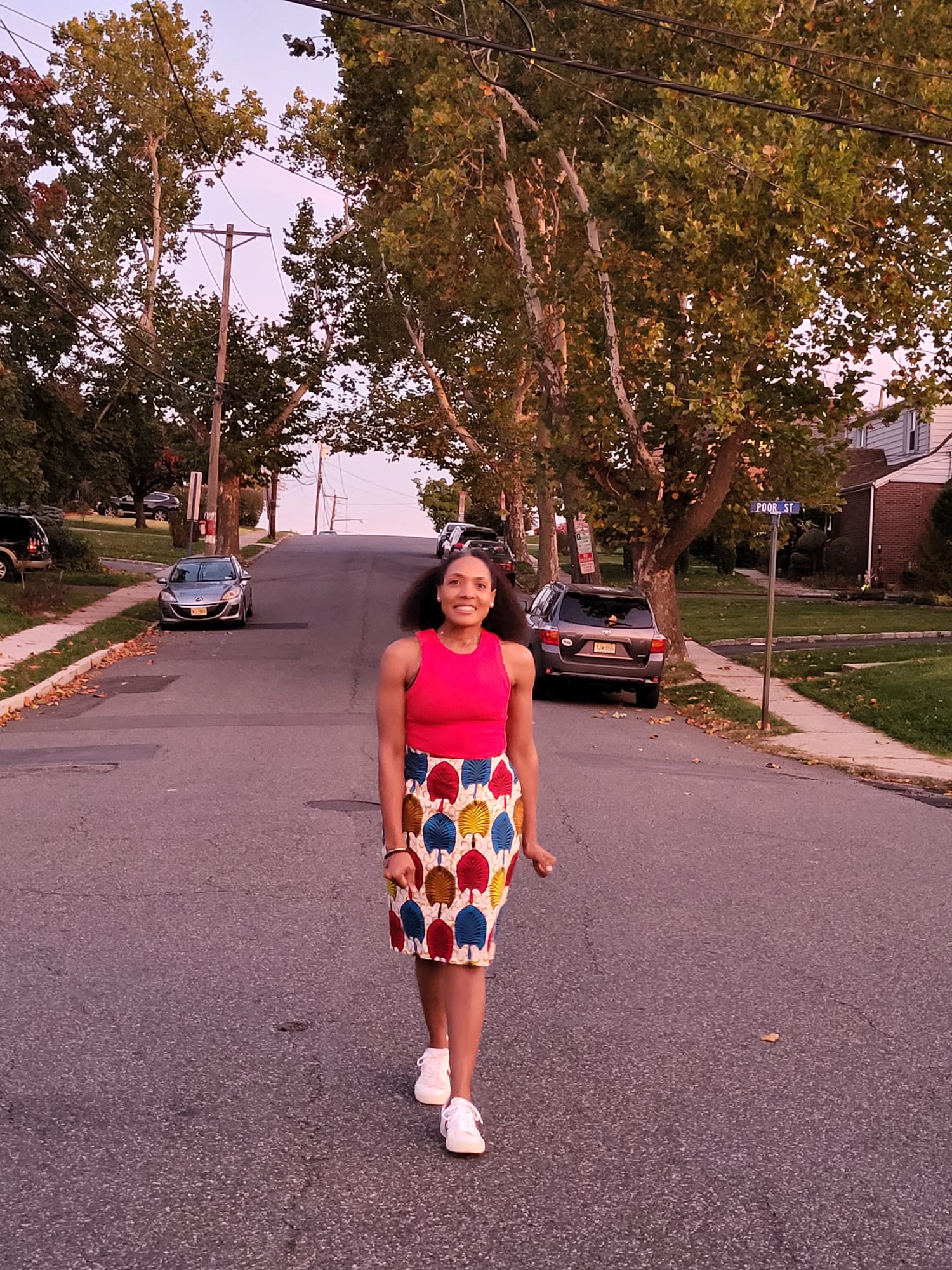 The Vivid Mini Skirt in red, blue and gold Ankara print, street style view